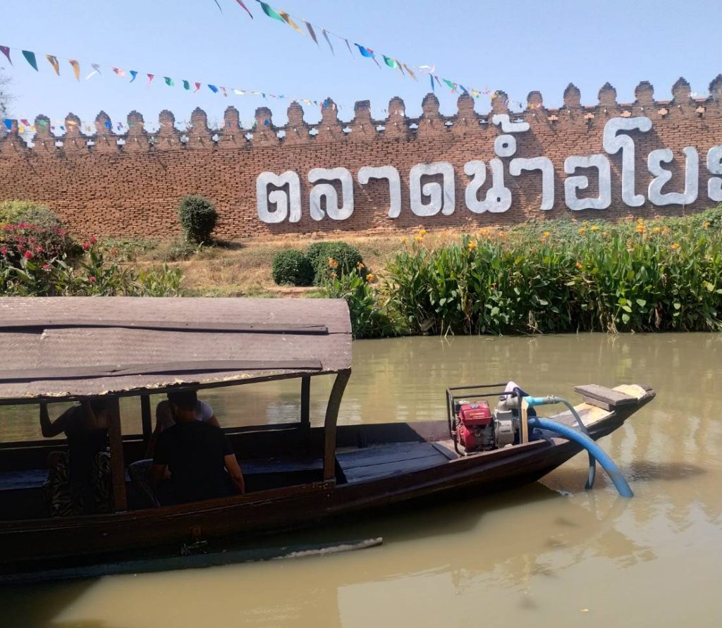 Boat on the water at Ayothaya Floating Market in Ayutthaya, Thailand.
