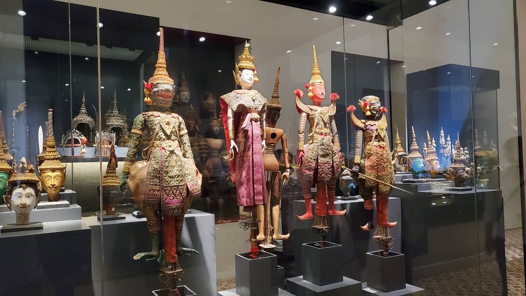 Traditional Thai dancer dolls in elegant classical costumes.